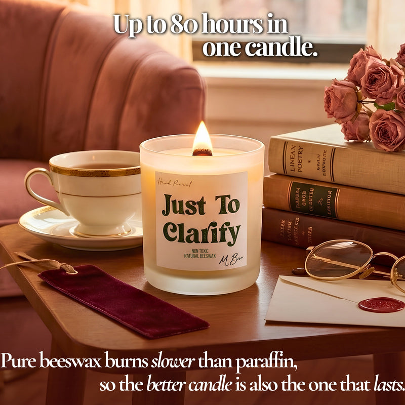 Lit Just To Clarify beeswax candle by teacup and books