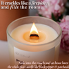 Lit beeswax candle with crackling wooden wick and pink flowers