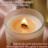 Lit beeswax candle with crackling wooden wick on pink silk