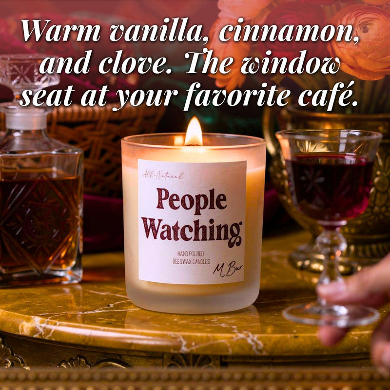 Lit People Watching beeswax candle with wine and decanter