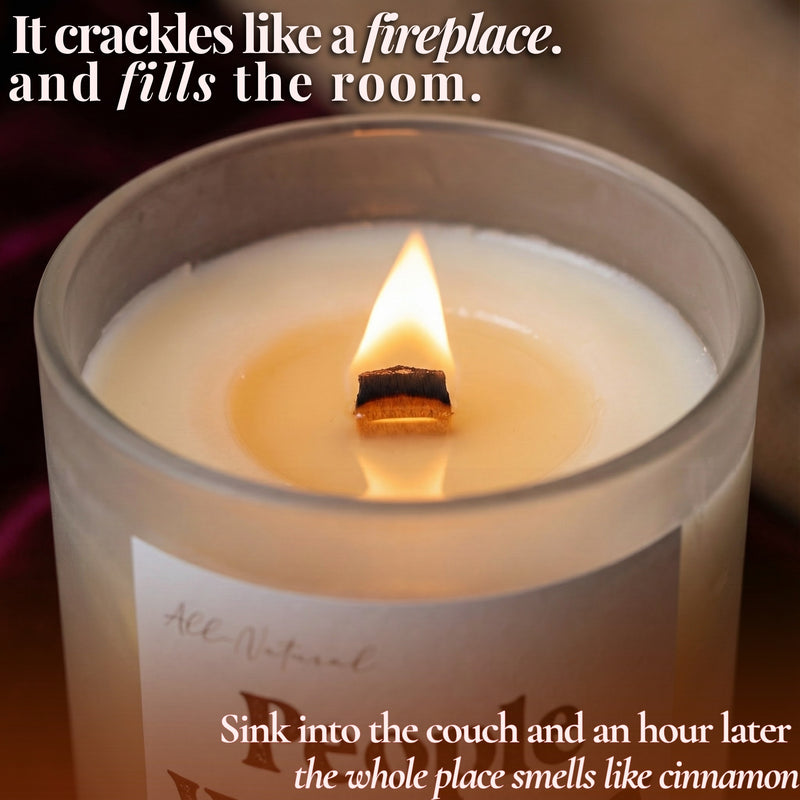 Lit beeswax candle with glowing wooden wick and crackling flame