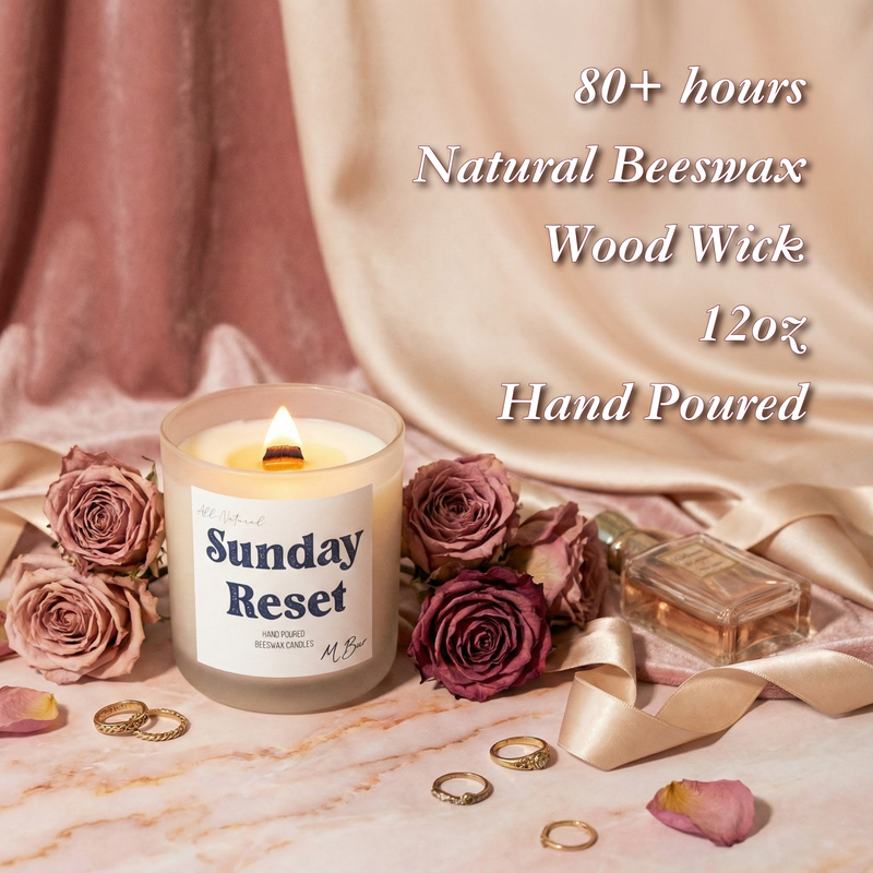 Lit Sunday Reset beeswax candle with wooden wick among dusty roses