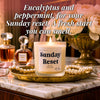 Lit Sunday Reset beeswax candle on gold tray with pearls and flowers