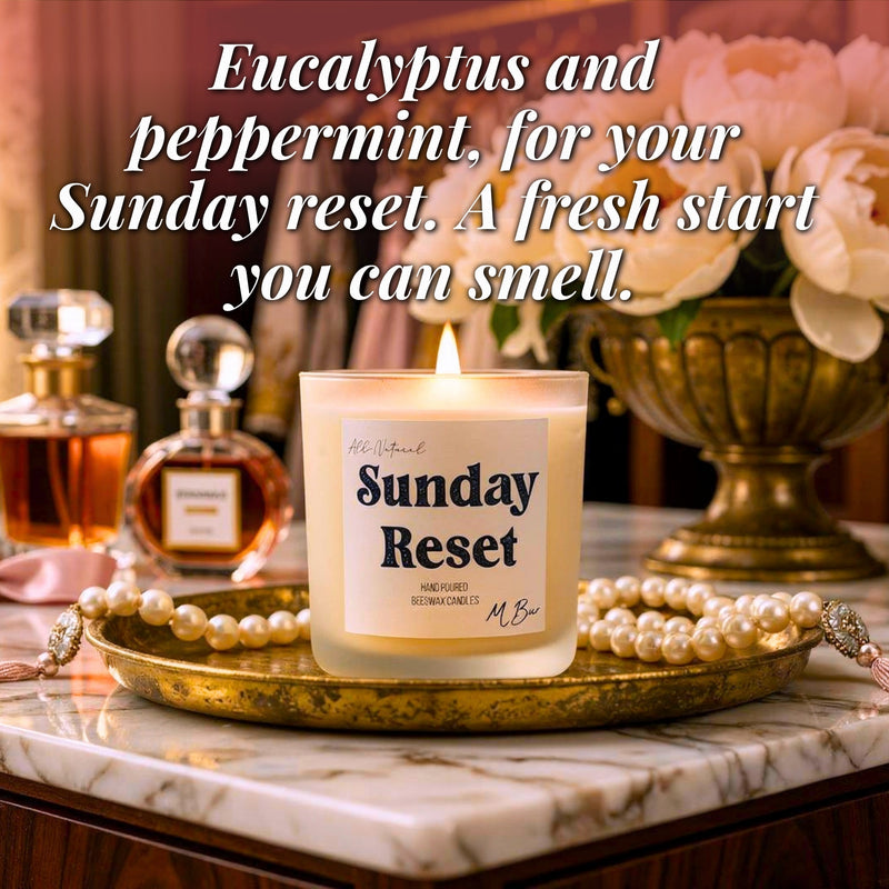 Lit Sunday Reset beeswax candle on gold tray with pearls and flowers