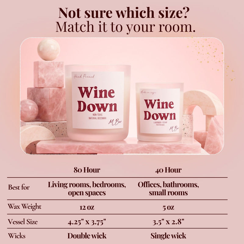 Wine Down candle size guide infographic with two pink candles