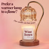 Wine Down beeswax candle under gold flower warmer lamp