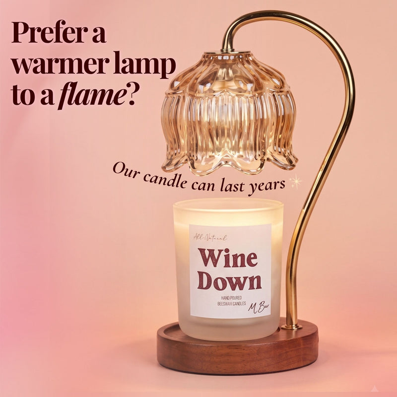 Wine Down beeswax candle under gold flower warmer lamp