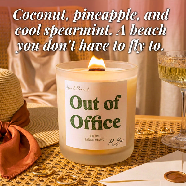 Lit Out of Office beeswax candle with wooden wick on rattan
